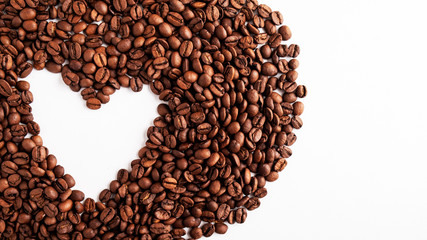Coffee beans heart background on white with copy space