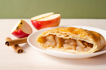 Apple strudel on a plate. Homemade pastries. 
