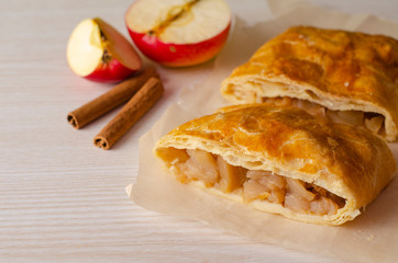 Apple strudel on a table. Homemade pastries. 
