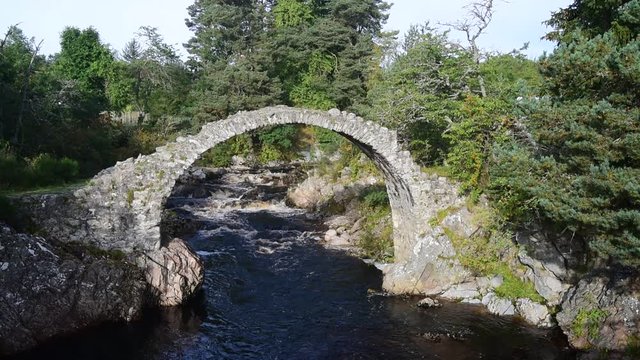 Pack Horse Funeral bridge over the river Dulnain, the oldest stone bridge in the Highlands at Carrbridge, Scotland, UK