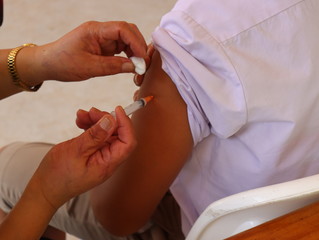 The nurse is vaccinating the students.