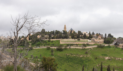 Fototapeta na wymiar View of the old city of Jerusalem, Dormition Abbey and King David Tomb from the Abu Tor district of Jerusalem city in Israel