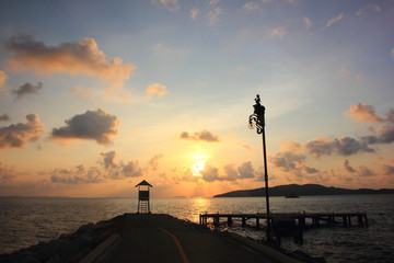 Fototapeta premium Small white house with morning on the sunset at Khao Laem Ya, Rayong ,Thailand.