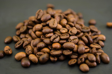 coffee beans on a black background. Close-up. A lot of grains.