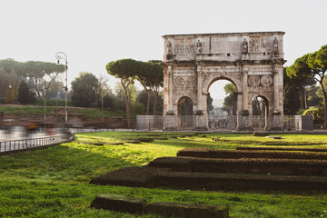 Fototapeta premium Arc di Trajan in Rome with tourists