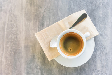 Top view of hot coffee with smoke on the table 