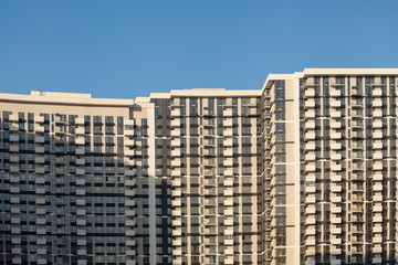 Fototapeta premium Modern and new apartment buildings. Multistoried modern, new and stylish living block of flats. Real estate. New house.Newly built block of flats