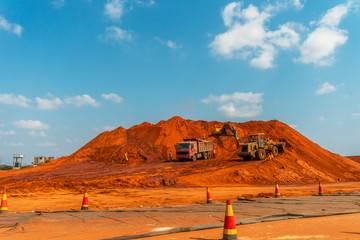 Road construction site with diggers and trucks, Mozambique