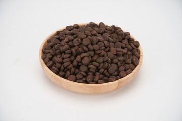 Dog food in wooden bowls on a white background