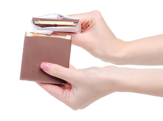 Chocolate bar in hand on white background isolation