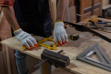 Asian carpenter man work and repair wood craft DIY at home ,portrait of happy attractive hardwork professional worker.