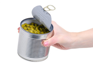 Hand holding canned green pea jar on white background isolation