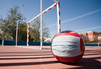 Soccer and coronavirus concept, soccer ball with respiratory mask on soccer field closed to the public, space to write