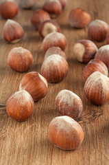  Hazelnuts on a wooden surface.