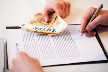 Employee is given a bribe for a favorable signing of the contract