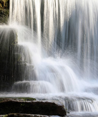 Fototapeta na wymiar Close up of waterfall, Monsal Dale Derbyshire