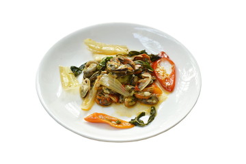 spicy stir fried mussel with slice onion and basil leaf on plate