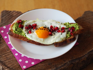 Avocado Toast with Sunny egg and Pomegranate