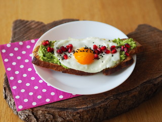 Avocado Toast with Sunny egg and Pomegranate