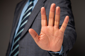 Businessman show hand sign for stop and holding, Concept of professional warning for stop new...