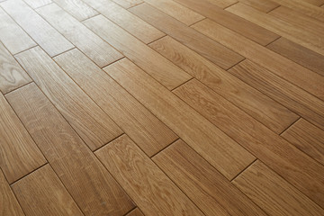 Natural wooden texture. New oak parquet. Wooden laminate floor boards background image. Polished oak pattern.