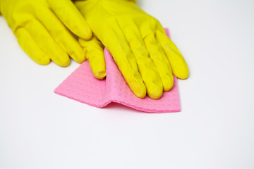 Closeup of worker hand wiping dust in office