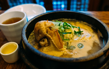 Ginseng Chicken Soup closeup, Korean favorite hot bowl menu