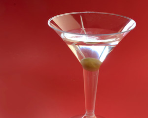 Dry martini served with an olive for a refreshing alcoholic drink for relaxation