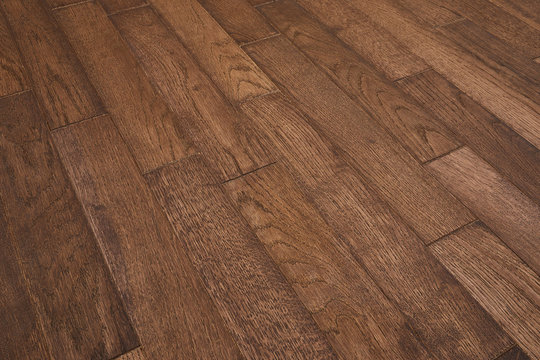 Natural wooden texture. New oak parquet. Wooden laminate floor boards background image. Polished oak pattern.