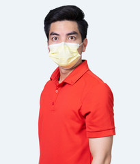 COVID-19 Coronavirus portrait handsome young asian .man wearing red shirt and mask protection from covid 19  isolated on white background in studio. Asian man people. COVID-19 concept.