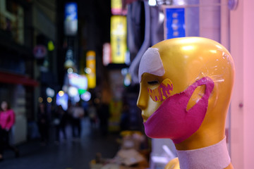 Beauty procedure and skin care product display on a mannequin head