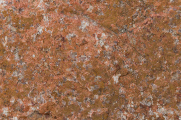 Granite textured surface abstract background. Red brown orange stone background