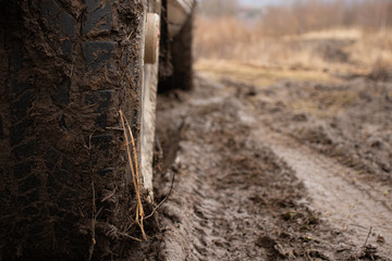 Off-road vehicle on a dirt track, off-road 4x4 in bad weather, visible dirt on wheels
