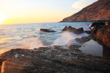 Rock and stone on the sunset at Khao Leam Ya ,Rayong Thailand,Amazing beach sunset. Long Exposure.