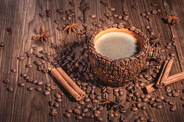 Coffee cup with coffee made from coffee beans wooden table Copy space. Coffee Cup Table Wood Grain coffee Side view Cinnamon stick.