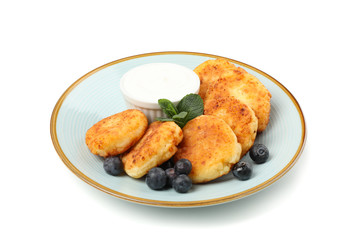 Plate with delicious cheese pancakes isolated on white background