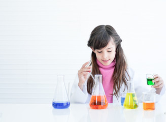 female scientist holding test tube with liquid