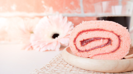 strawberry jam roll on pastel background.
