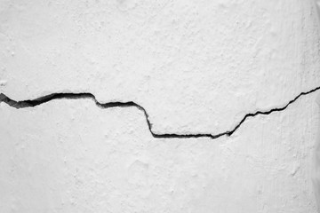 Crack in the white wall. The concept of schism or contradiction.