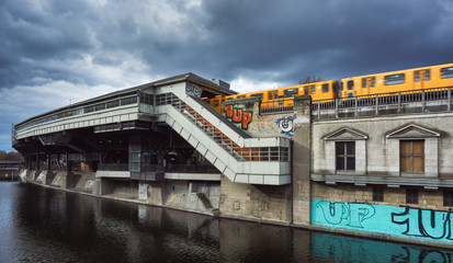 U-Bahn station Berlin near the river Underground metro station with a yellow train