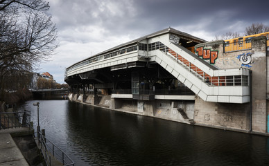 U-Bahn station Berlin near the river Underground metro station with a yellow train