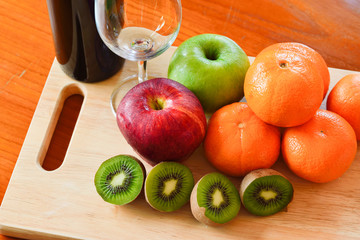 Red wine and fresh fruits on the table