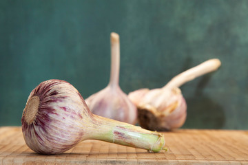 Lying head of young garlic and two heads of last year