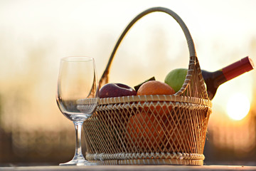 Glasses of the red wine on lawn summer picnic