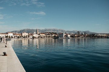 Beautiful sunset over old city Split, Croatia. Boats and city walls are in frame. Arial view. Landscape photos of cost line.