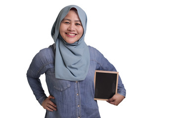 Smart Asian Muslim Woman  Smiling at Camera and Showing Empty Blackboard