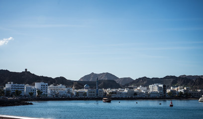 Fototapeta premium Sunny day in the Muscat bay with the Mutrah fort in the background, Oman