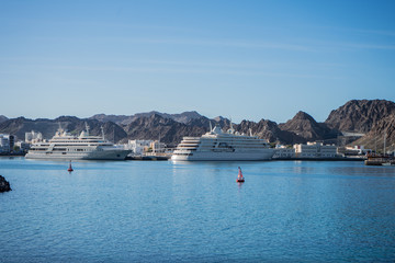 Naklejka premium Two yachts docked in the Muscat bay, Oman