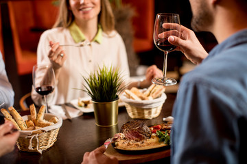 Beautiful loving couple is spending time together in modern restaurant
