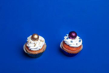 Sweet, colorful cupcakes decorated with sugar paste and cream. Concept of art paty.